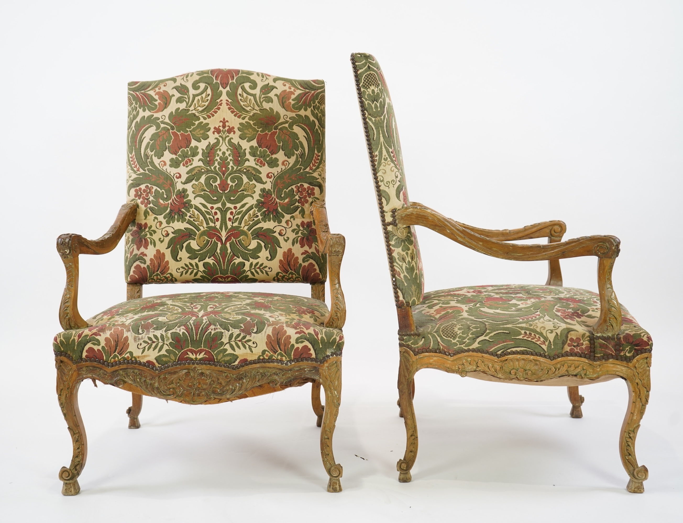 A pair of 19th century Louis XV style carved walnut grand fauteuil
